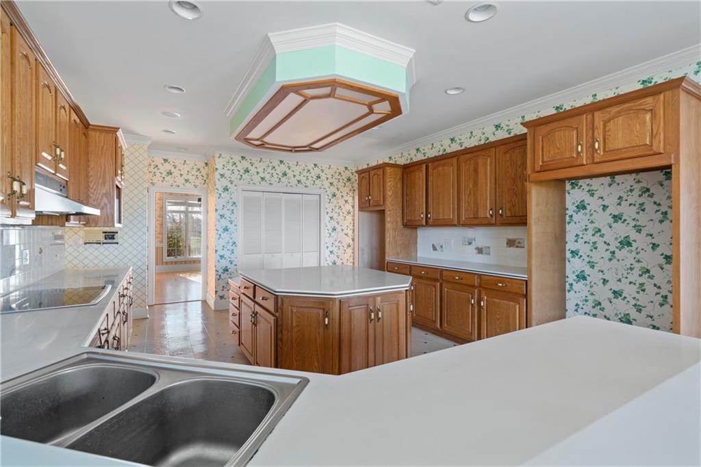 5414 Price Road Gainesville, GA 30506 - Photo 33 of 82 a kitchen with stainless steel appliances a sink a stove a refrigerator and cabinets
