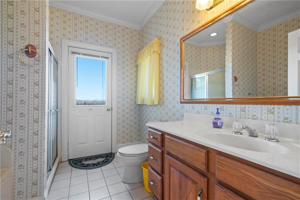 5414 Price Road Gainesville, GA 30506 - Photo 51 of 82 a bathroom with a sink toilet and shower
