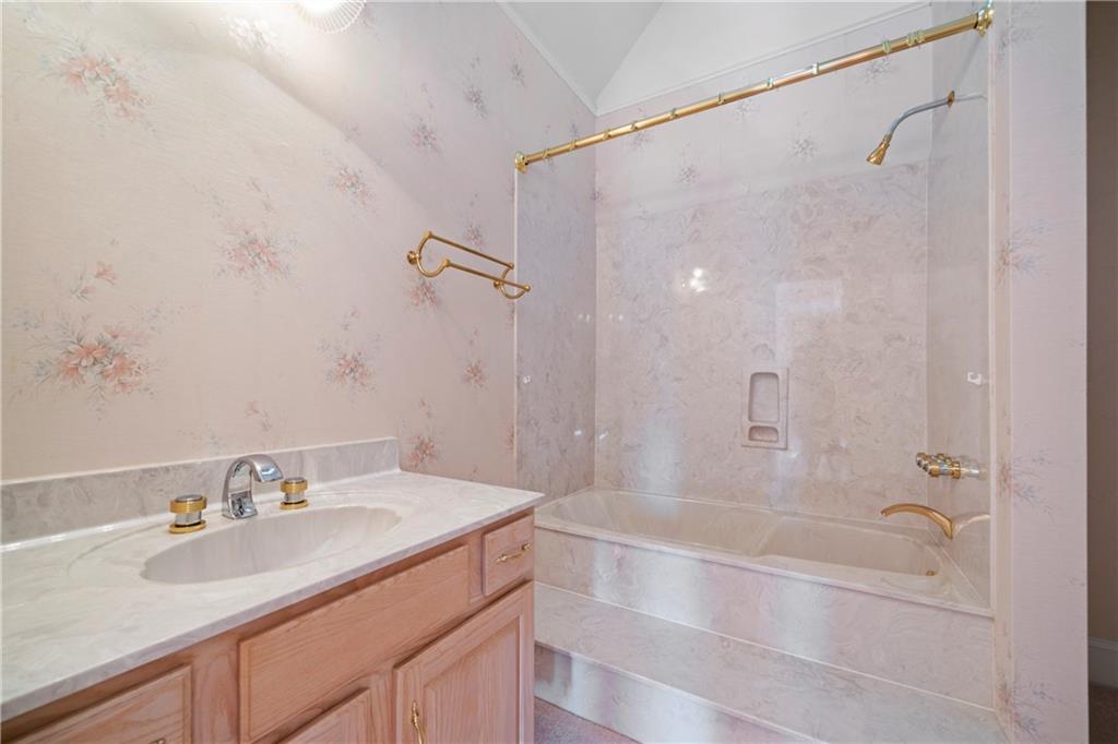 5414 Price Road Gainesville, GA 30506 - Photo 53 of 82 a bathroom with a granite countertop sink a toilet and shower