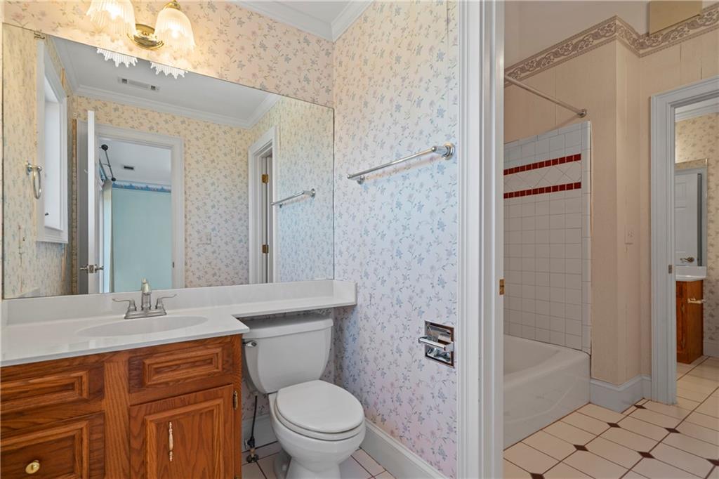 5414 Price Road Gainesville, GA 30506 - Photo 55 of 82 a bathroom with a sink a toilet and shower