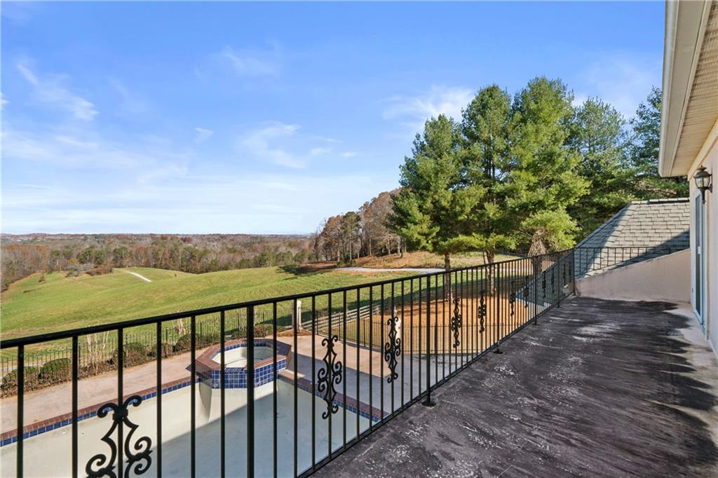 5414 Price Road Gainesville, GA 30506 - Photo 56 of 82 a view of a balcony with wooden floor and city view