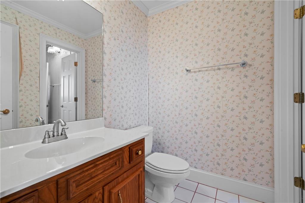 5414 Price Road Gainesville, GA 30506 - Photo 59 of 82 a bathroom with a sink a toilet and shower