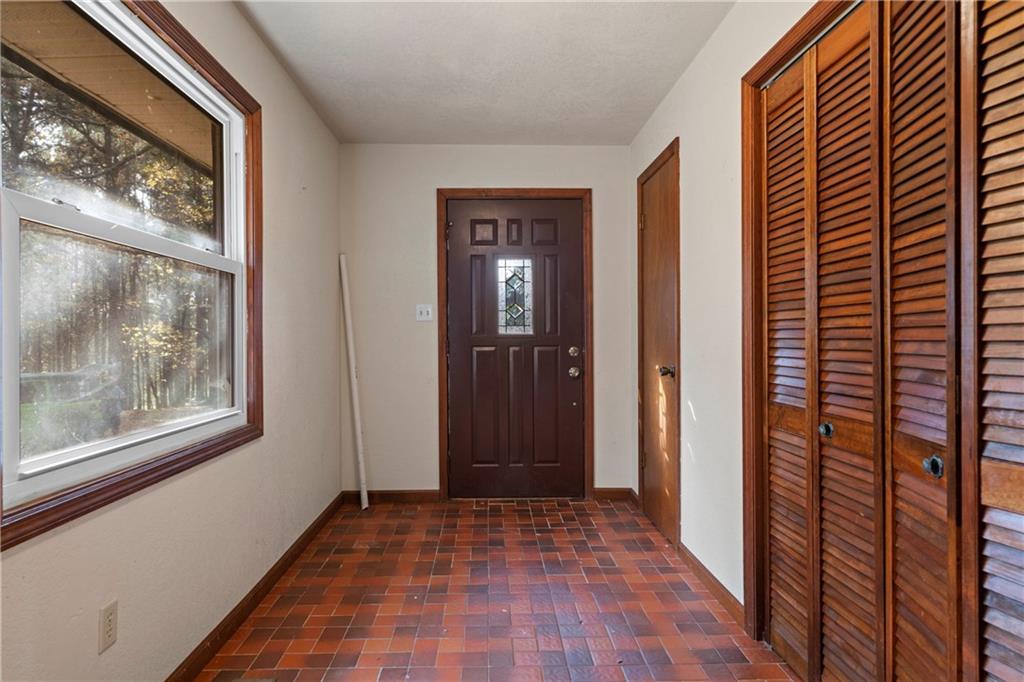 5414 Price Road Gainesville, GA 30506 - Photo 66 of 82 a view of an empty room with wooden floor and a window