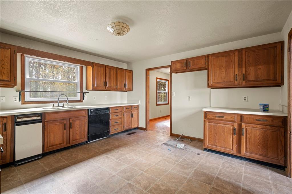 5414 Price Road Gainesville, GA 30506 - Photo 72 of 82 a kitchen with stainless steel appliances granite countertop a stove sink and cabinets
