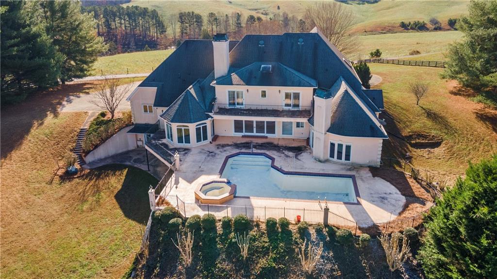 5414 Price Road Gainesville, GA 30506 - Photo 9 of 82 an aerial view of a house with swimming pool and large trees