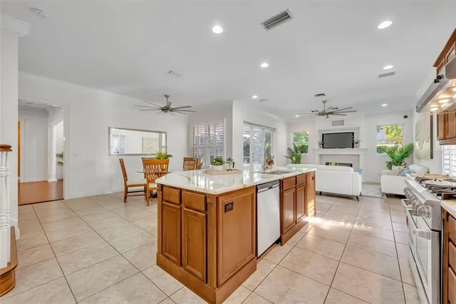 a kitchen with a sink and a stove top oven