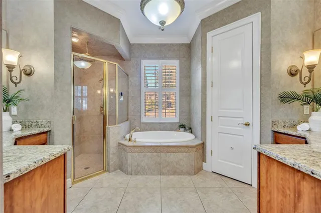 a spacious bathroom with a granite countertop sink and a mirror