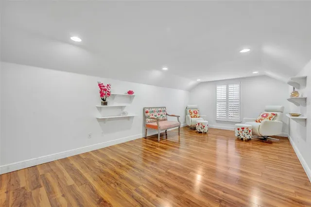 a room with wooden floor and table
