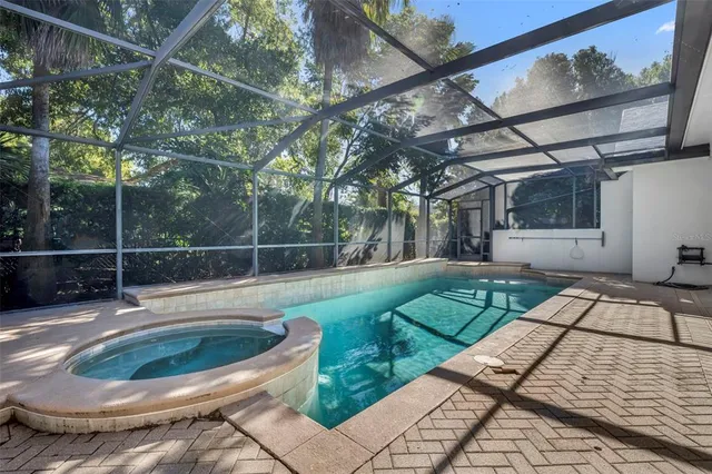 a view of a backyard with sitting area