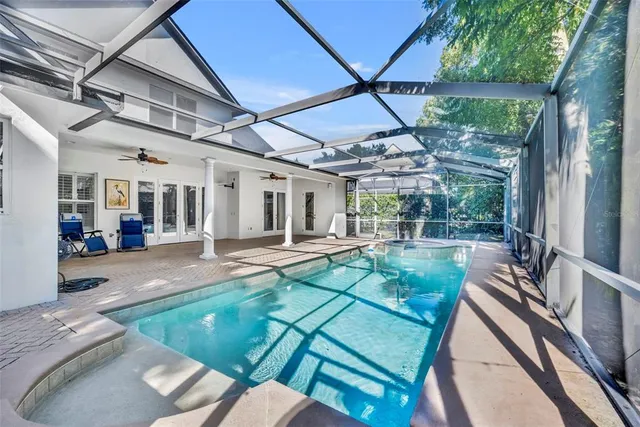 a view of a backyard with a patio and garden