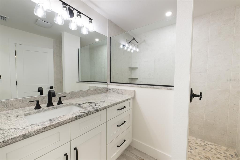 8846 Southwest Liverpool Road Arcadia, FL 34269 - Photo 27 of 29 a bathroom with a sink a vanity and a mirror