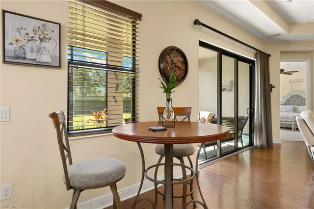 a kitchen with stainless steel appliances granite countertop a sink a stove a refrigerator cabinets and couches