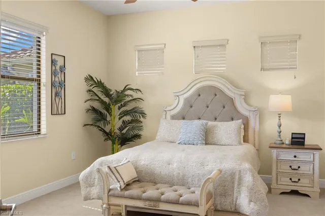 a bathroom with a granite countertop double vanity sink mirror and