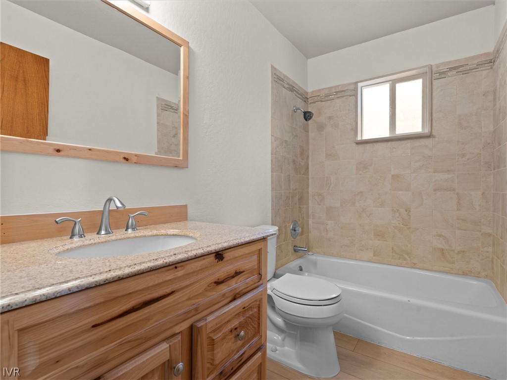 1106 Altdorf Terrace Incline Village, NV 89451 - Photo 28 of 50 a bathroom with a granite countertop toilet a sink and a bathtub