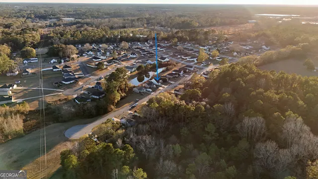 an aerial view of residential house with outdoor space