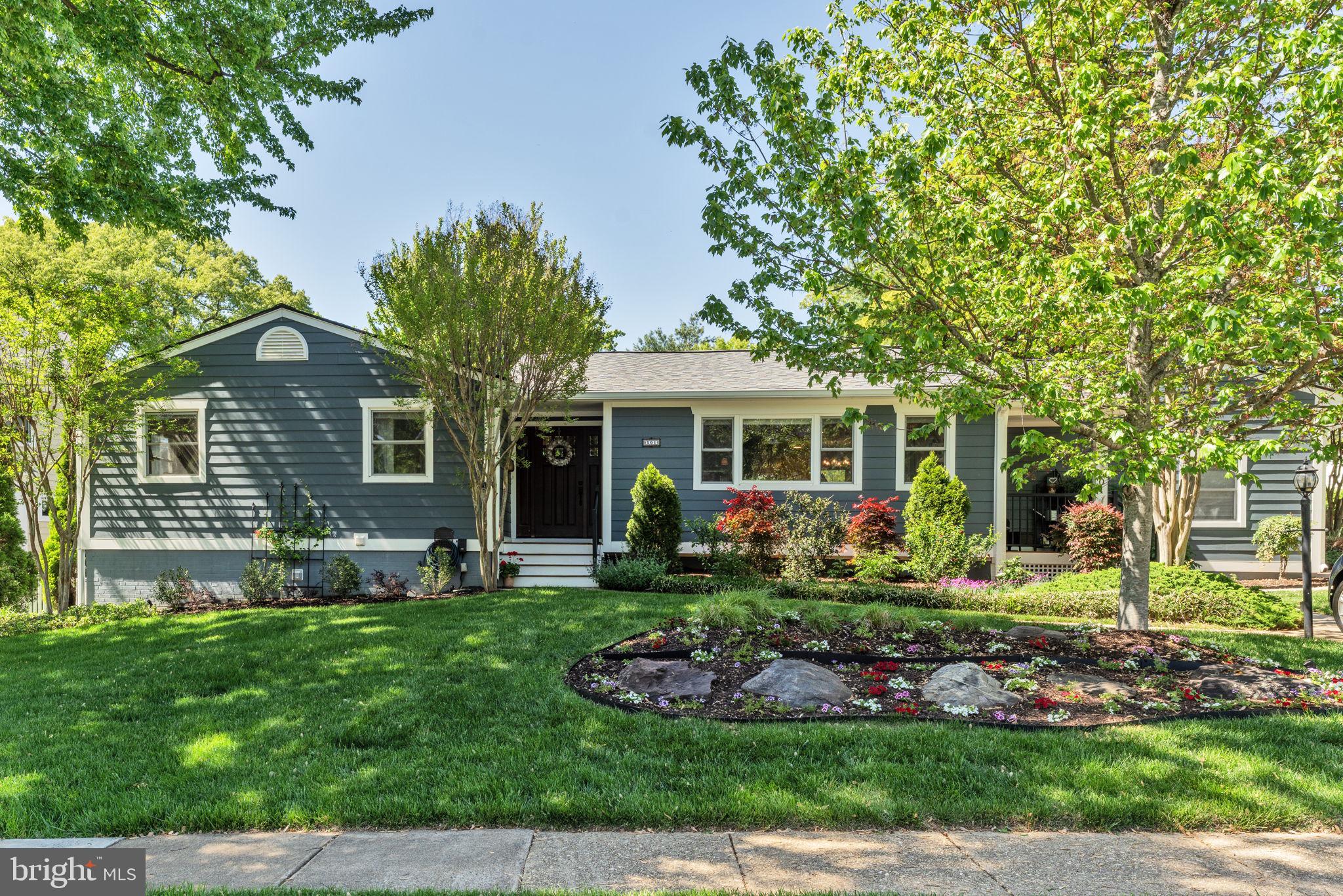 501 Ridge Road Southwest Vienna, VA 22180 - Photo 1 of 54 a front view of a house with a yard and porch