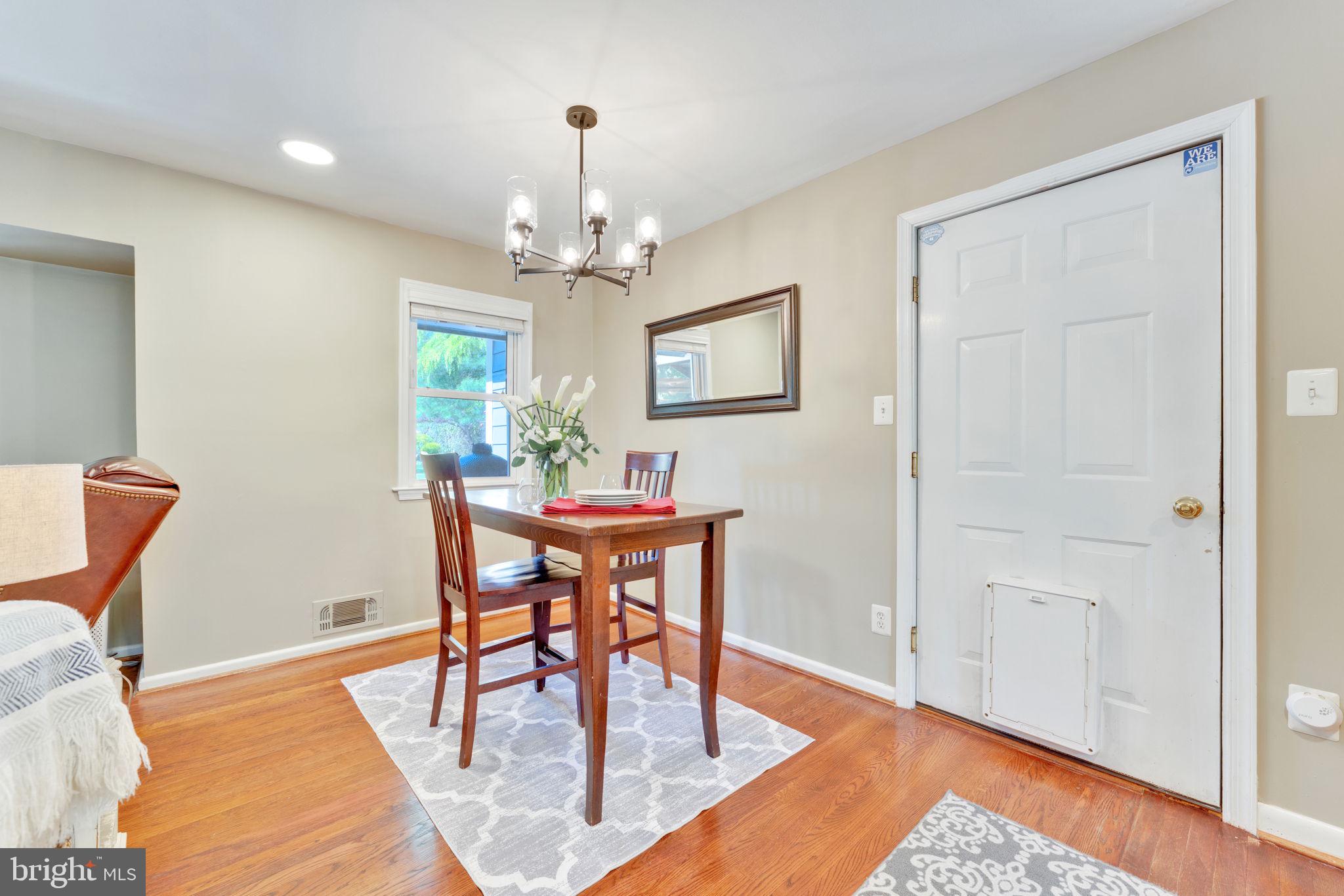 501 Ridge Road Southwest Vienna, VA 22180 - Photo 15 of 54 a view of a dining room with furniture and wooden floor
