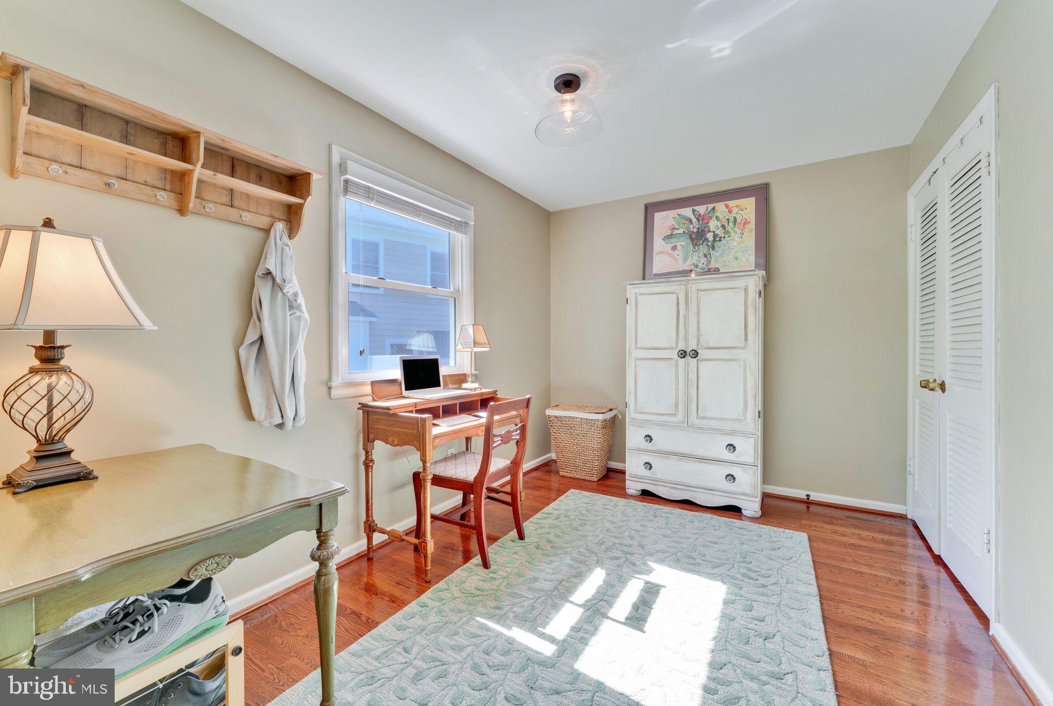 501 Ridge Road Southwest Vienna, VA 22180 - Photo 26 of 54 a room with furniture a rug and a window