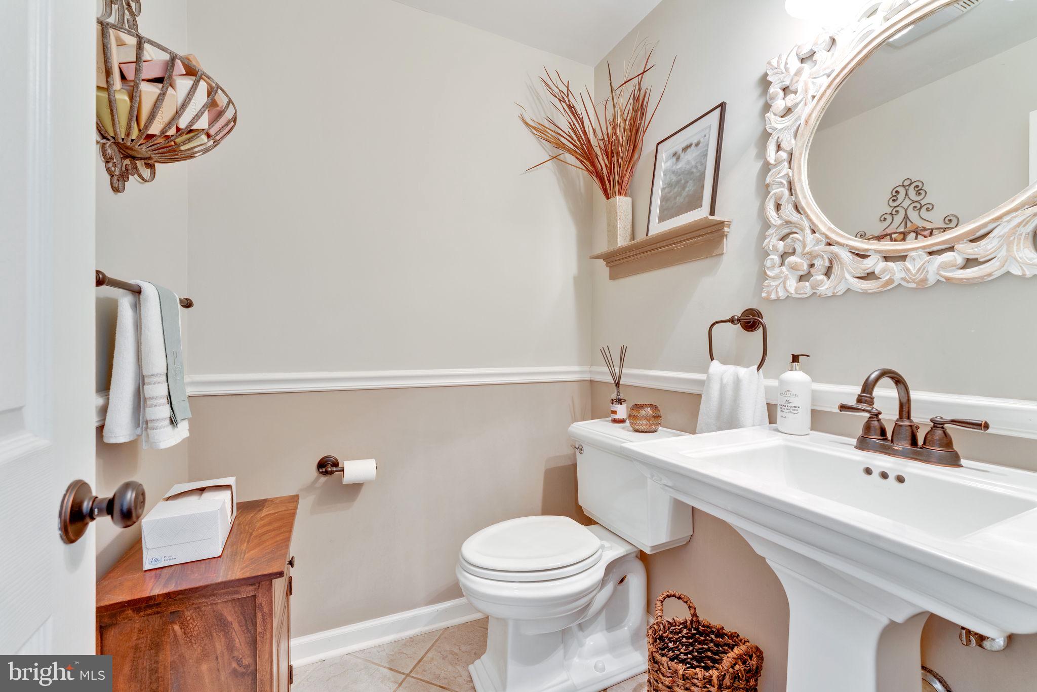 501 Ridge Road Southwest Vienna, VA 22180 - Photo 31 of 54 a bathroom with a sink a toilet and a mirror