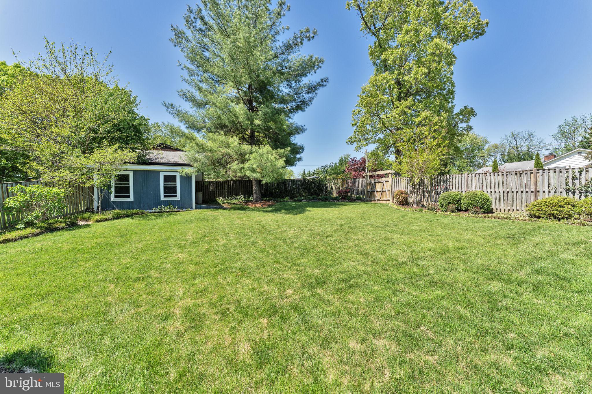 501 Ridge Road Southwest Vienna, VA 22180 - Photo 45 of 54 a view of a house next to a big yard and large trees