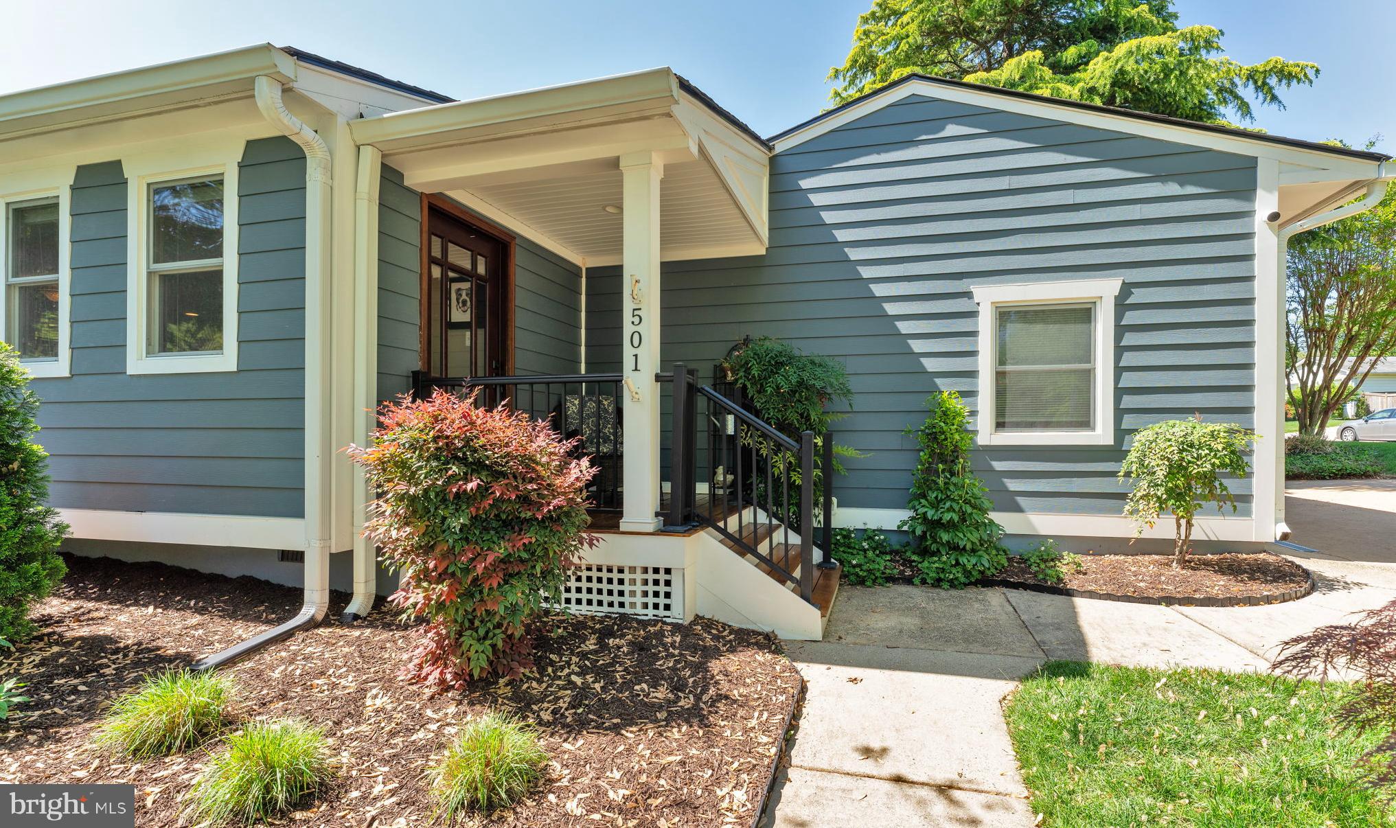 501 Ridge Road Southwest Vienna, VA 22180 - Photo 5 of 54 a front view of a house with a yard