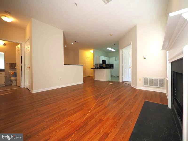 1705 Lake Shore Crest Drive, Unit 23 Reston, VA 20190 - Photo 11 of 45 a view of a kitchen with a sink and a refrigerator