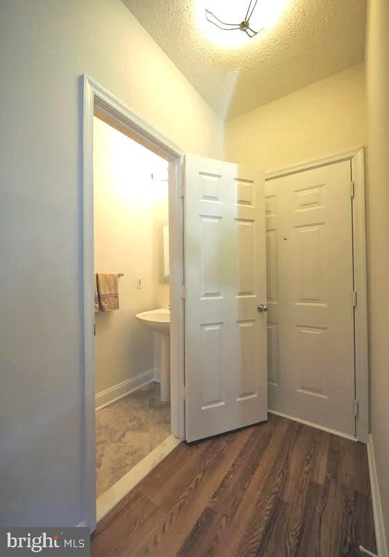 1705 Lake Shore Crest Drive, Unit 23 Reston, VA 20190 - Photo 12 of 45 a bathroom with a glass shower door and a sink