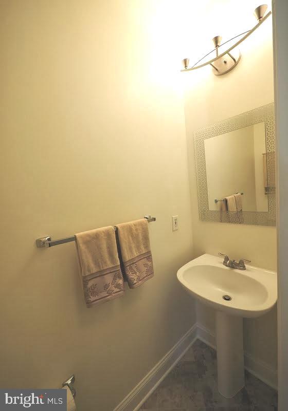1705 Lake Shore Crest Drive, Unit 23 Reston, VA 20190 - Photo 20 of 45 a bathroom with a sink and a mirror