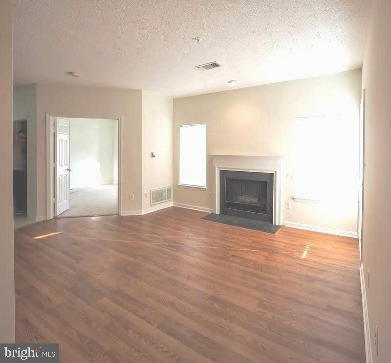 1705 Lake Shore Crest Drive, Unit 23 Reston, VA 20190 - Photo 26 of 45 a view of empty room with a fireplace