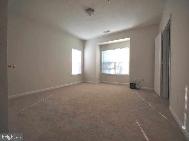 1705 Lake Shore Crest Drive, Unit 23 Reston, VA 20190 - Photo 34 of 45 a view of empty room with window