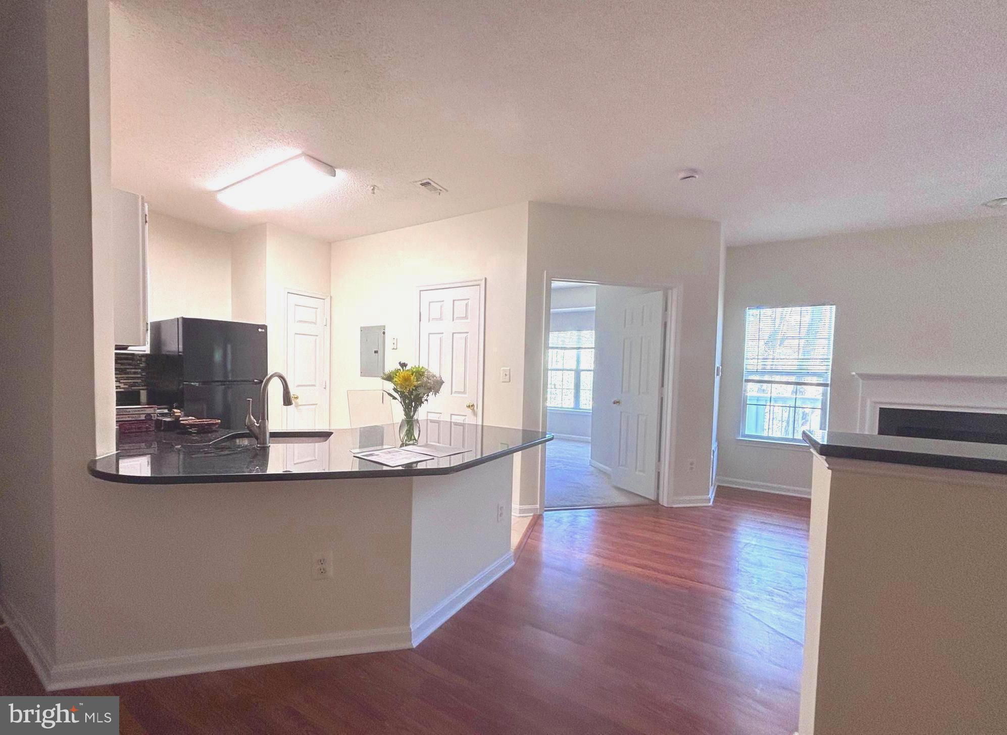 1705 Lake Shore Crest Drive, Unit 23 Reston, VA 20190 - Photo 5 of 45 a view of kitchen with sink and refrigerator