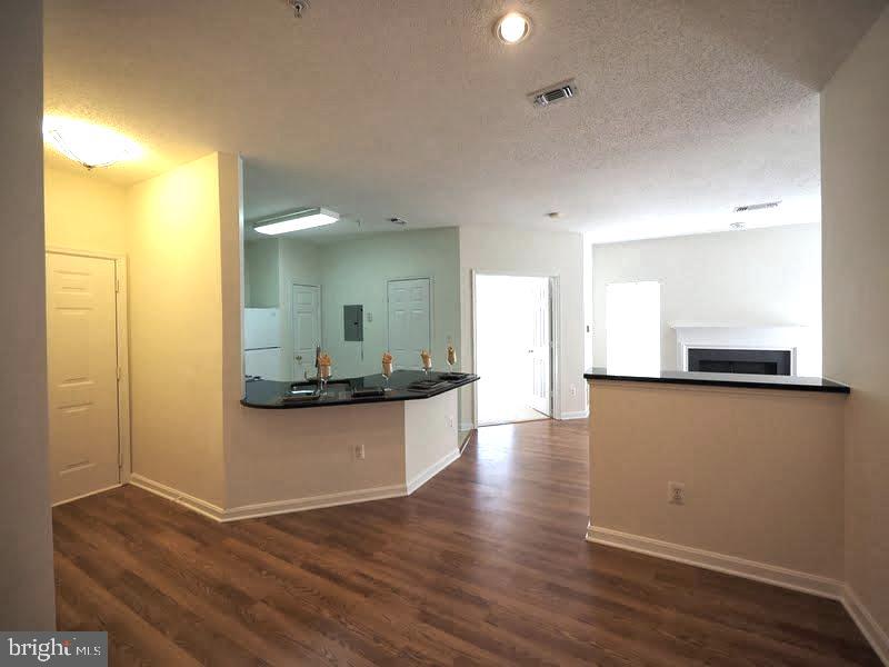 1705 Lake Shore Crest Drive, Unit 23 Reston, VA 20190 - Photo 7 of 45 a view of a living room with wooden floor