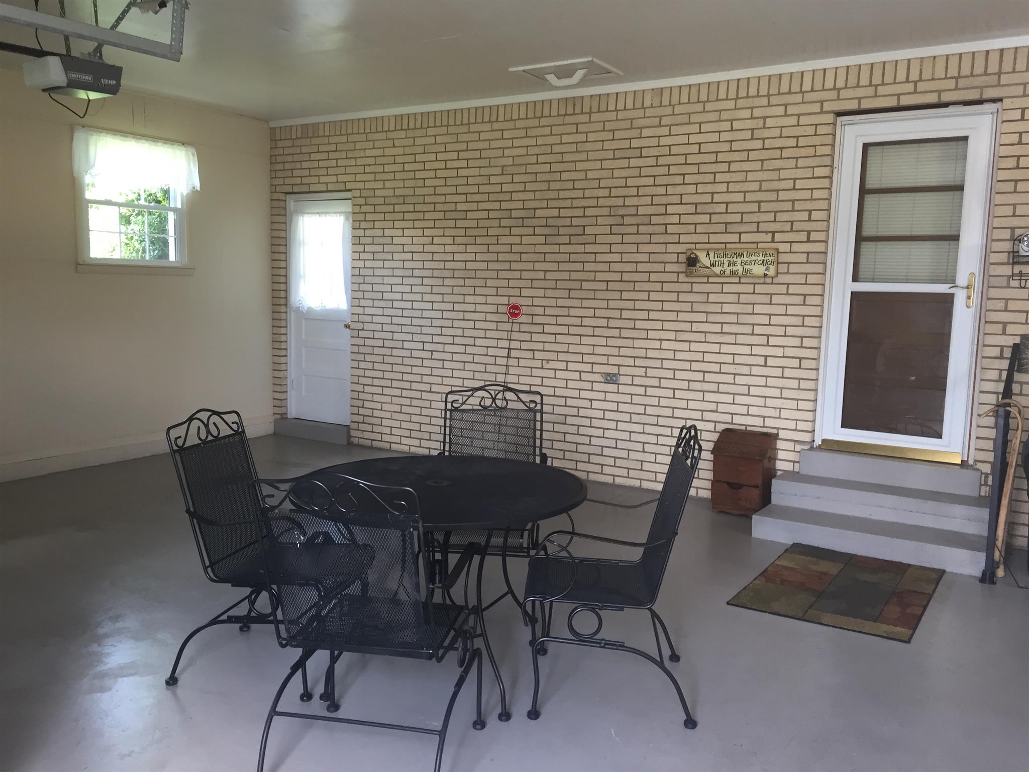 640 Gamaliel Road Red Boiling Springs, TN 37150 - Photo 3 of 16 Attached carport with garage door opener.