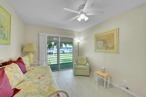 a bedroom with a bed furniture and a window