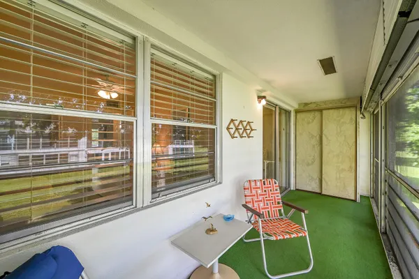 an aerial view of residential houses with outdoor space and swimming pool