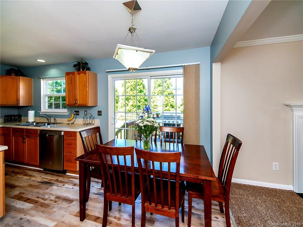 631 Eaton Court Fort Mill, SC 29708 - Photo 4 of 15 a view of a dining room with furniture window and outside view