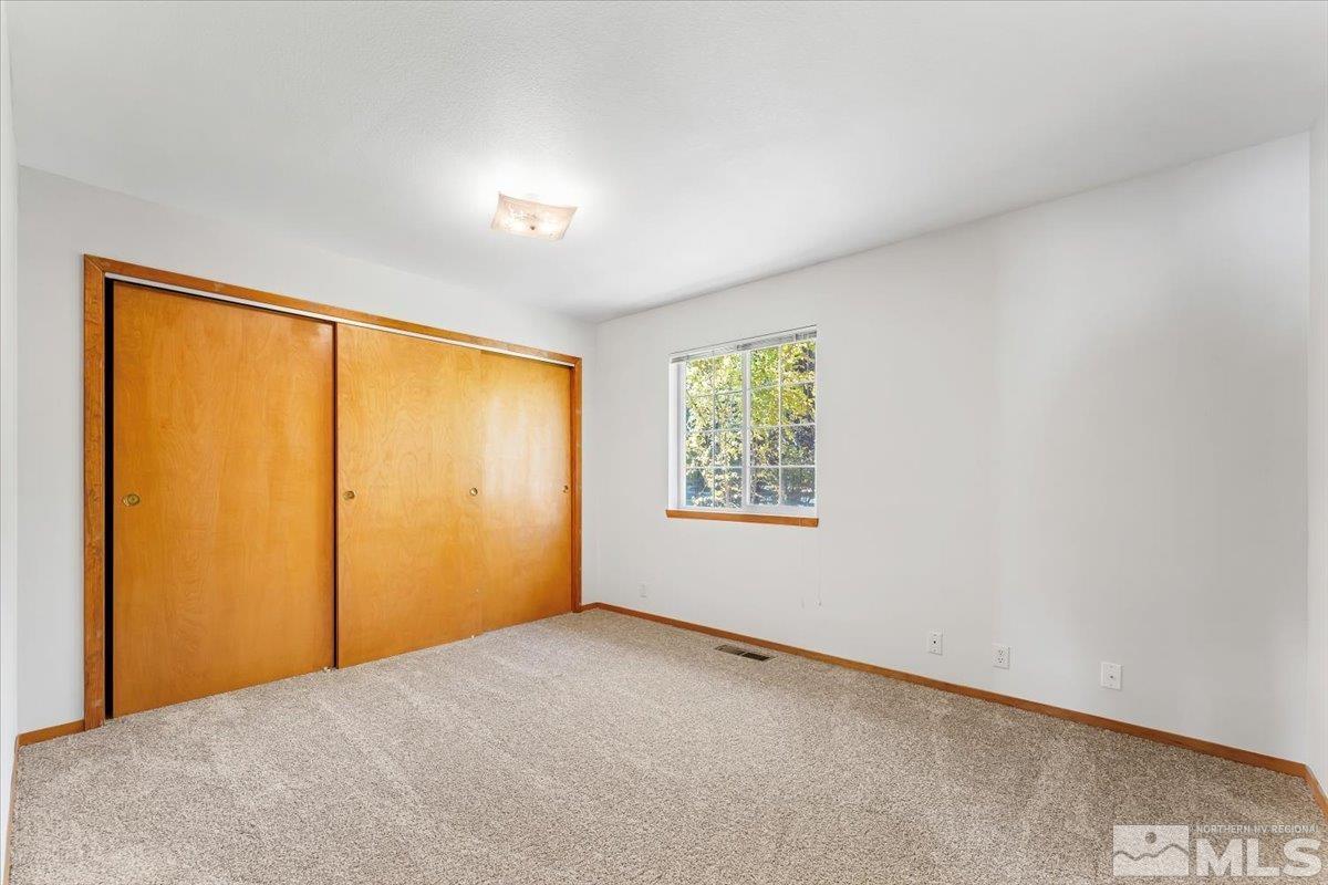 155 Andrew Lane Reno, NV 89521 - Photo 13 of 35 an empty room with a window
