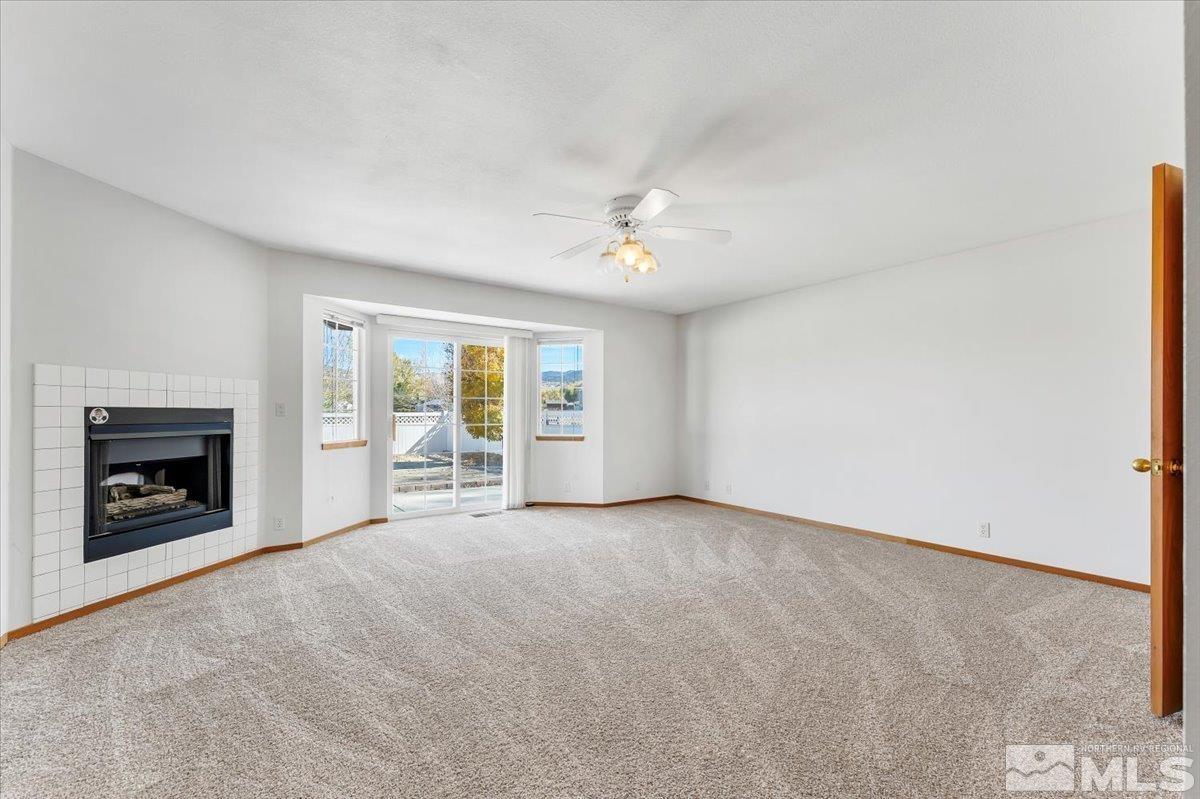 155 Andrew Lane Reno, NV 89521 - Photo 14 of 35 an empty room with furniture and a fireplace