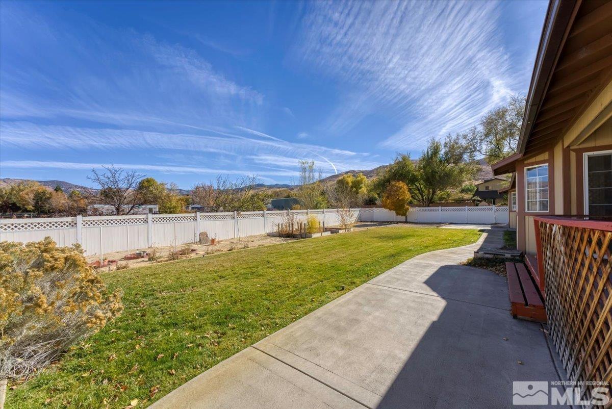 155 Andrew Lane Reno, NV 89521 - Photo 19 of 35 a view of a lake with a yard