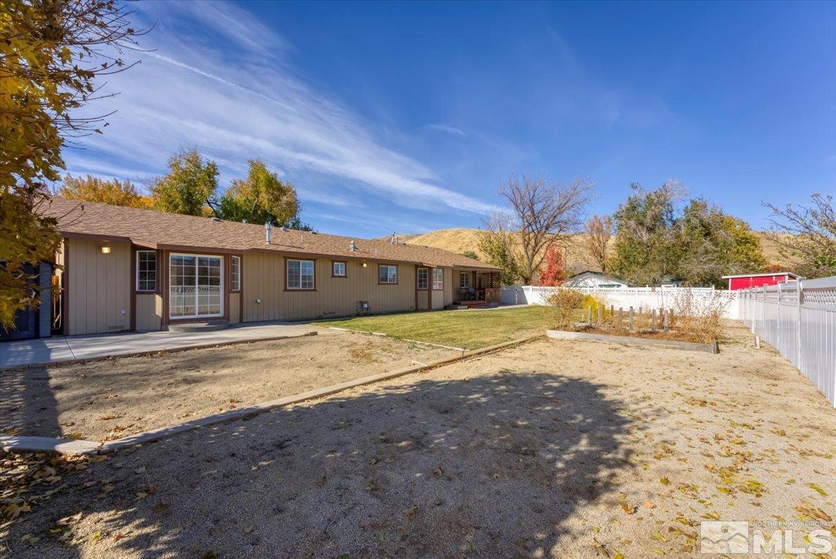 155 Andrew Lane Reno, NV 89521 - Photo 25 of 35 a house with a yard and a large tree