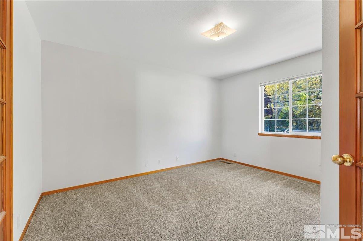 155 Andrew Lane Reno, NV 89521 - Photo 10 of 35 an empty room with a window