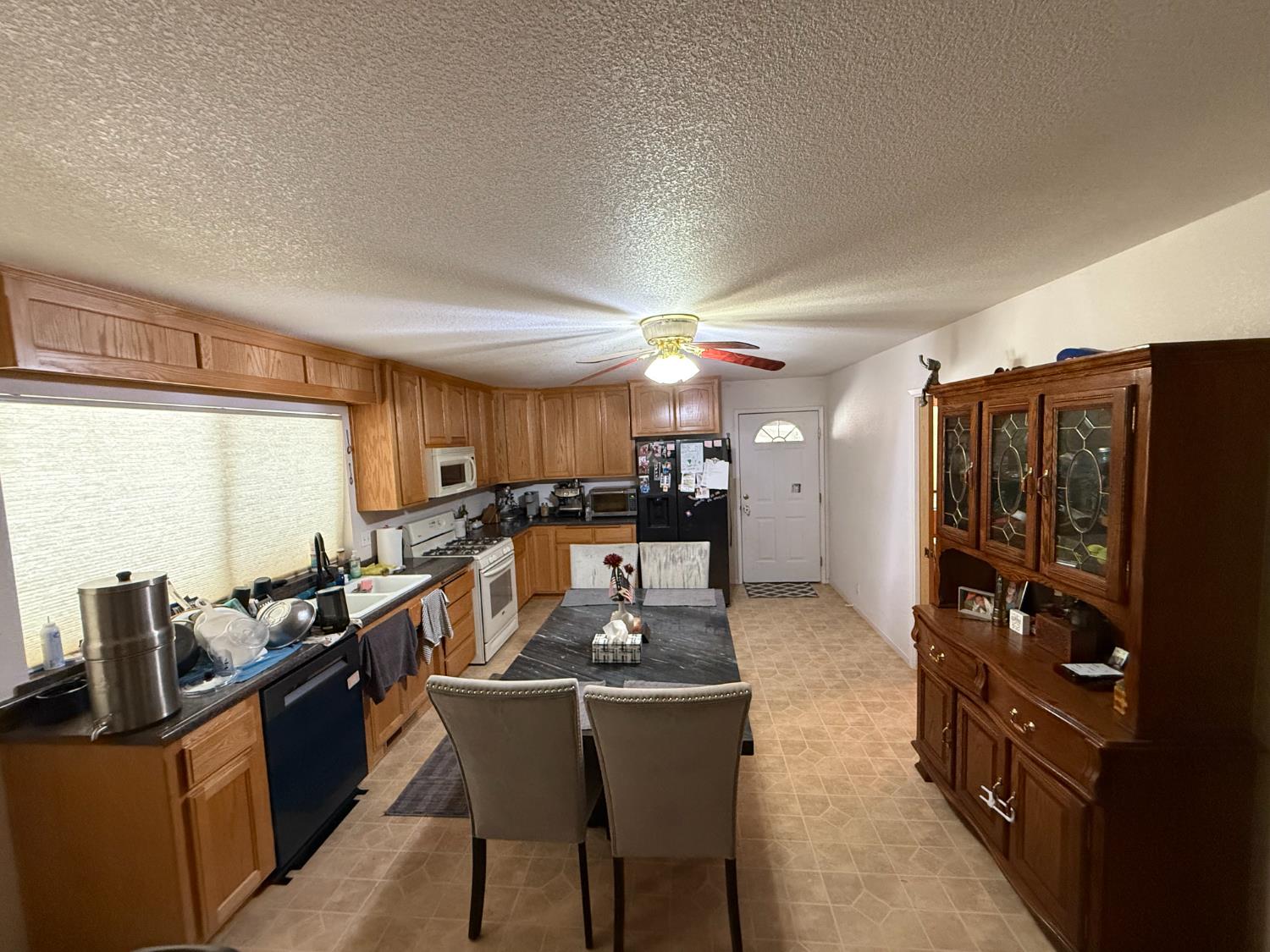 1546 Skull Springs Road West Point, CA 95255 - Photo 11 of 35 a kitchen with granite countertop a refrigerator stove top oven and sink
