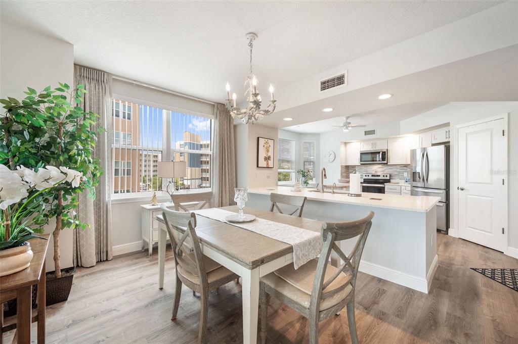 960 Starkey Road, Unit 8206 Largo, FL 33771 - Photo 11 of 71 a view of a dining room with furniture window and wooden floor