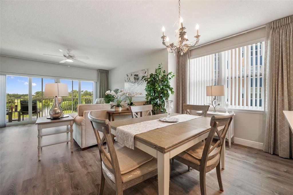 960 Starkey Road, Unit 8206 Largo, FL 33771 - Photo 13 of 71 a view of a dining room with furniture window and outside view