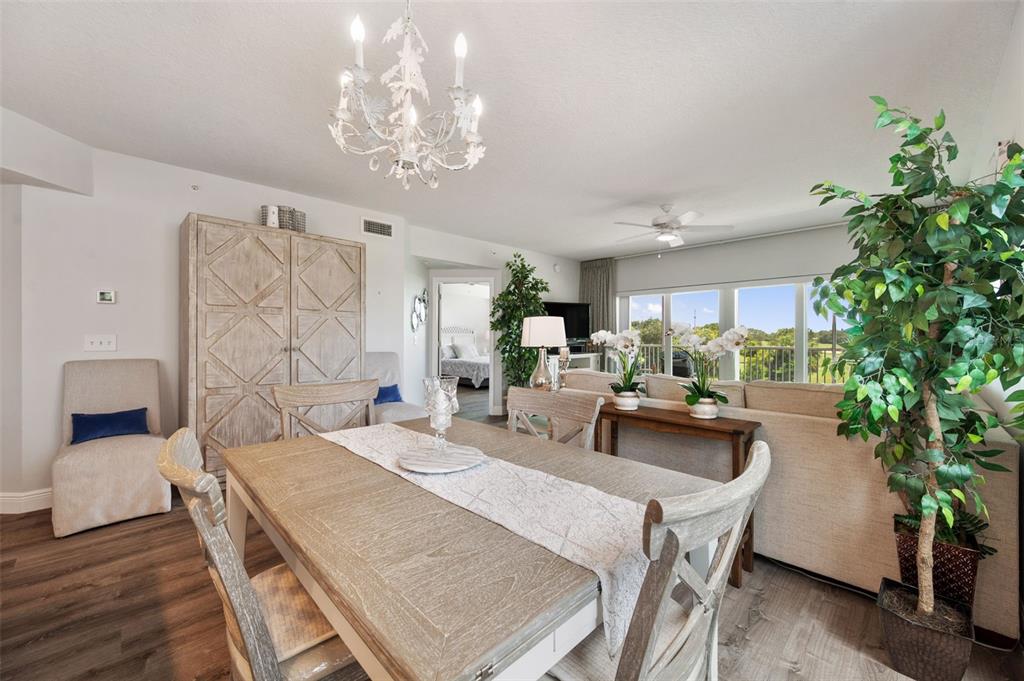 960 Starkey Road, Unit 8206 Largo, FL 33771 - Photo 14 of 71 a living room with furniture and a chandelier