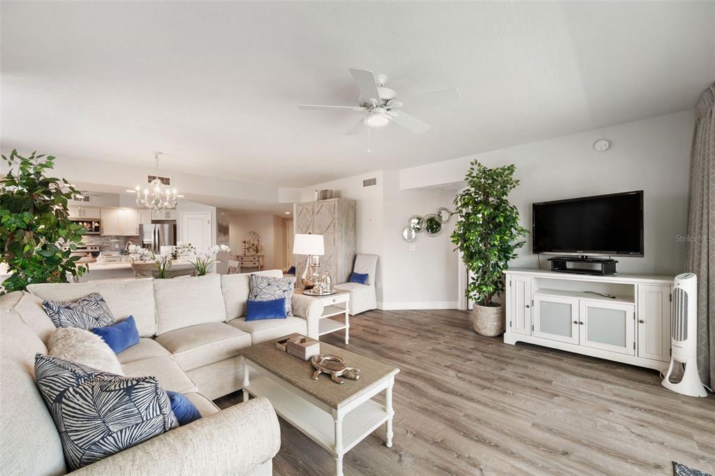 960 Starkey Road, Unit 8206 Largo, FL 33771 - Photo 16 of 71 a living room with furniture and a flat screen tv