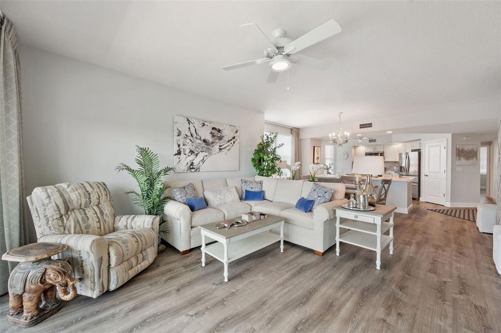 960 Starkey Road, Unit 8206 Largo, FL 33771 - Photo 17 of 71 a living room with furniture and a chandelier