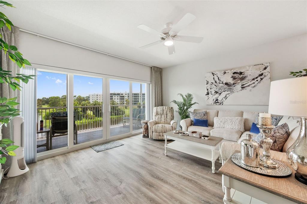 960 Starkey Road, Unit 8206 Largo, FL 33771 - Photo 20 of 71 a living room with furniture and wooden floor