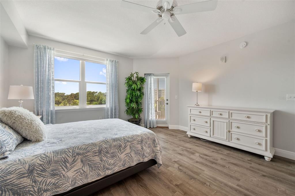 960 Starkey Road, Unit 8206 Largo, FL 33771 - Photo 21 of 71 a bedroom with a large bed and a window