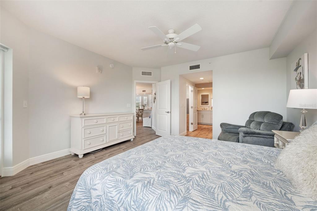 960 Starkey Road, Unit 8206 Largo, FL 33771 - Photo 23 of 71 a bedroom with a bed and wooden floor